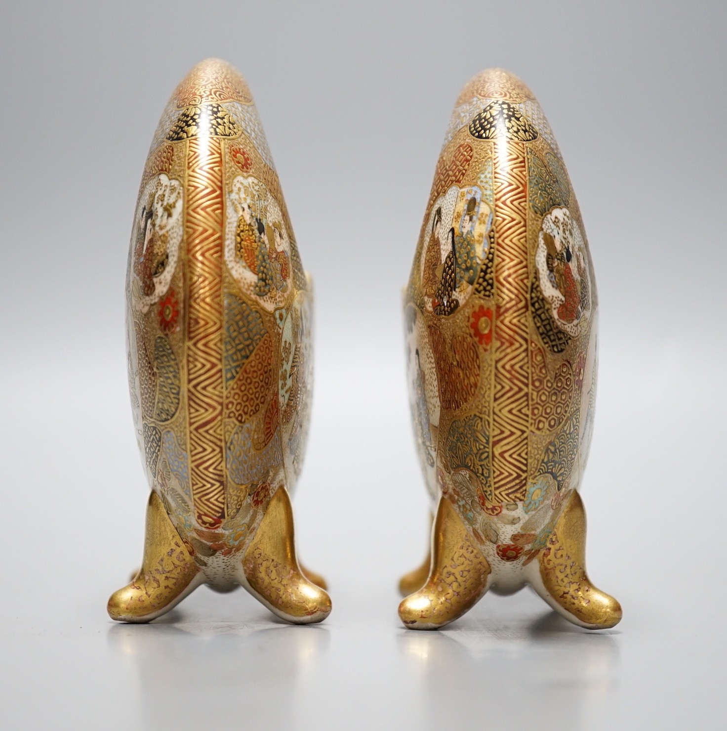 A pair of Japanese Satsuma crescent vases on quad footed base, signed to base, 11.5cm tall